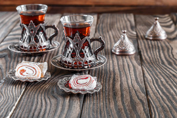 istock Fragrant Turkish tea and Turkish sweets in national dishes 1048973846
