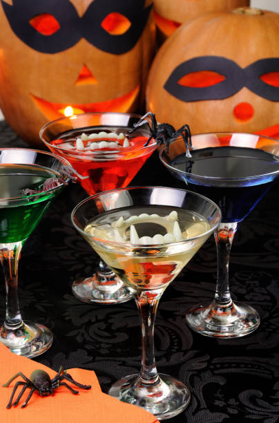 istock Glasses with different drinks on the table in honor of Halloween 1048975184