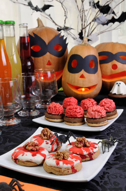 istock Table served with a variety of sweets and drinks on Halloween 1048975216