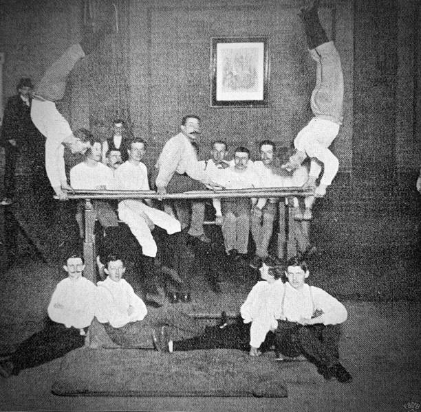 Gymnastics on high bar in the gymnasium Image from 19th century gymnastics bar photos stock pictures, royalty-free photos & images