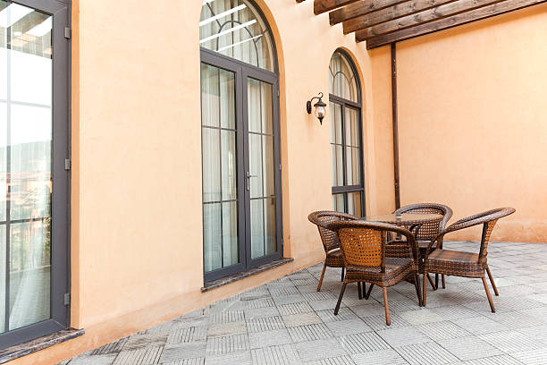 istock Patio with rattan chairs and table 104899037