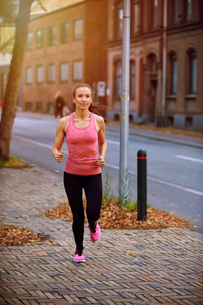 istock lifestyle running in the street 1048990678