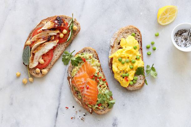 istock Gravlax, avocado , chicken breast, scrambled eggs sandwiches 1048991326