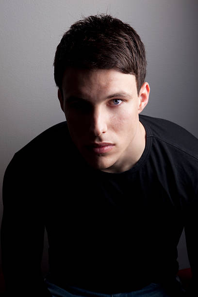 istock Young Male Face in Black Shirt 104899285
