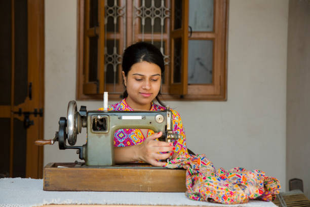 istock Indian Young Girl Sewing - Stock image 1048994466