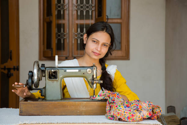 istock Indian Young Girl Sewing - Stock image 1048994630