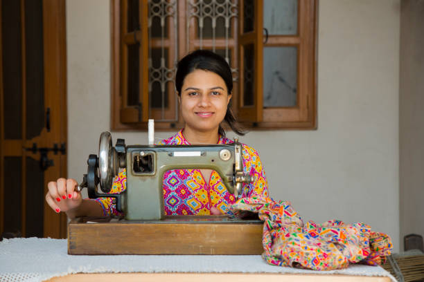 istock Indian Young Girl Sewing - Stock image 1048995088