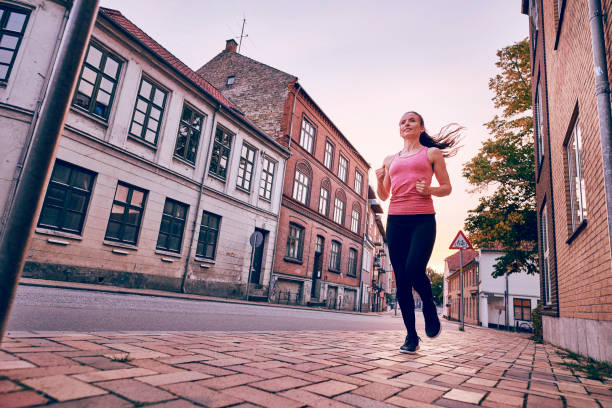istock lifestyle running in the street 1048995132
