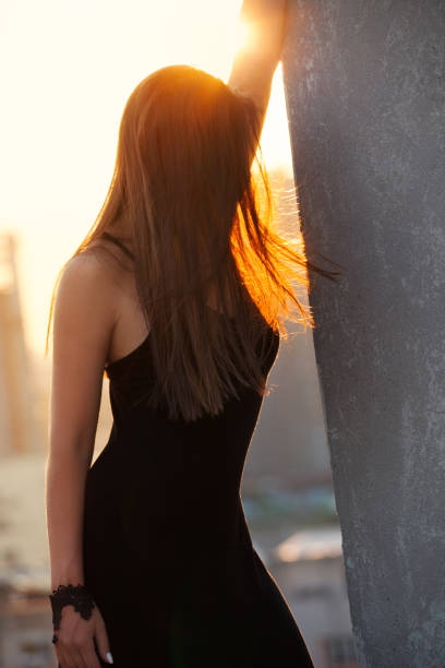 istock woman at sunset 1048995144