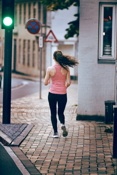istock Lifestyle running in the street 1048995334