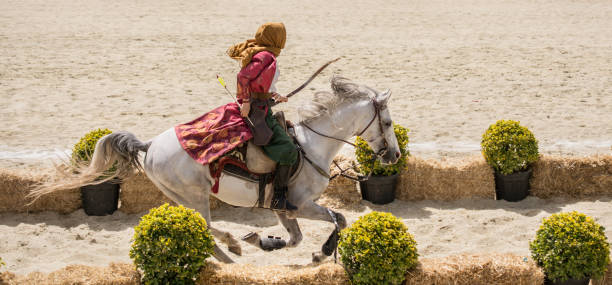 July 6 2025: Windsor NSW - A man rides on horseback in preparation for a jousting match as one of the events at the yearly medieval faire in Windsor called Winterfest.