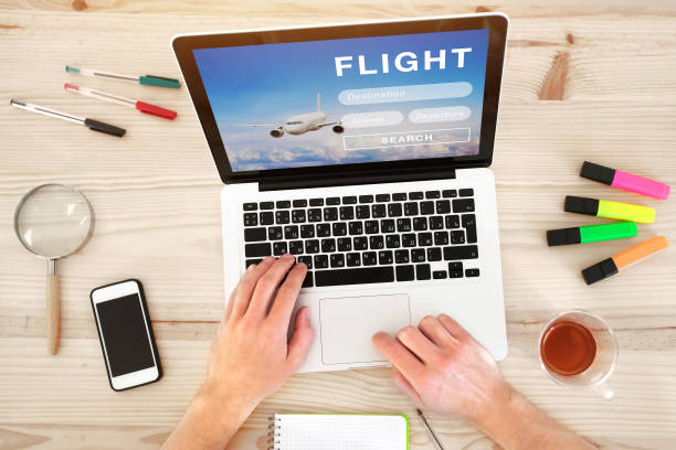 istock buy airplane ticket online, book flight on internet 1049000550