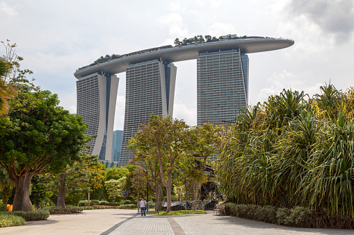 Marina South, Singapore - September 05 2018: Famous landmark Marina Bay Sands hotel viewed from the garden.