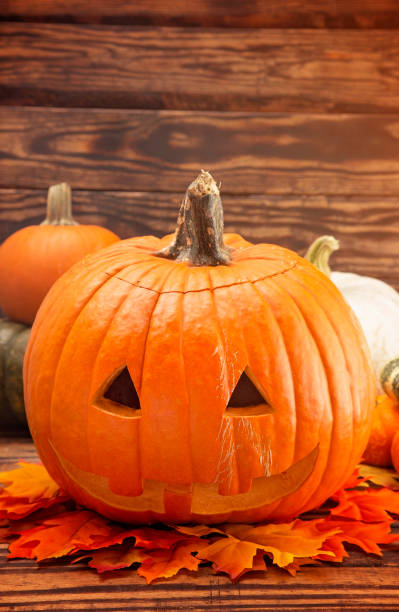 istock A Carved Jack O Lantern on a Wooden Table 1049006988