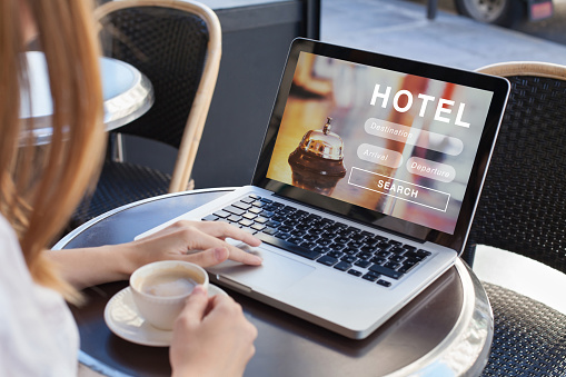 booking hotel on internet, travel planning, online reservation concept, woman looking at screen of computer searching  accommodation