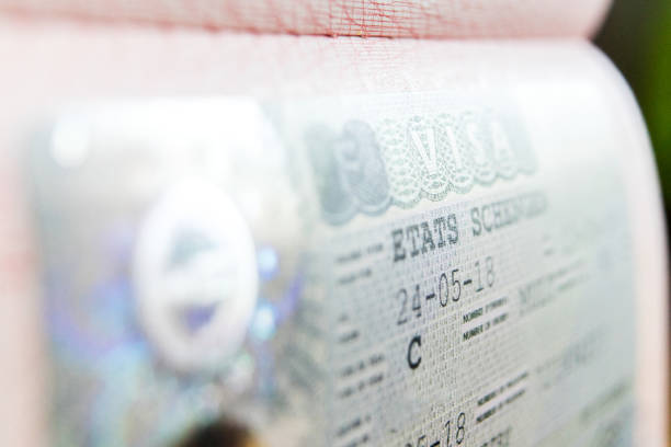 istock Visa stamp travel passport immigration macro emigration 1049008812