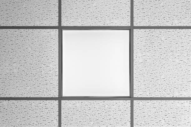 ceiling lamp type LED panel is integrated into the suspended ceiling with soundproof panels, type of office lighting, interior abstraction background ceiling lamp type LED panel is integrated into the suspended ceiling with soundproof panels, type of office lighting, close up interior abstraction background ceiling tile lighting stock pictures, royalty-free photos & images