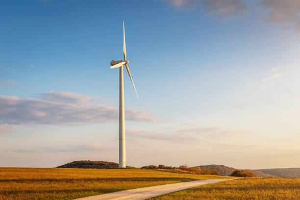 Modern wind turbine in rural landscape at sunset. Green Energy, Alternative Energy Environment Concept Shot. Baden Württemberg, Germany.