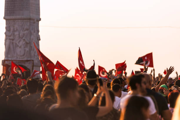 Izmir, Turkey - September 9, 2018. September 9 Independence day of Izmir. Crowded people in the square of Gundogdu and a Turkish flag in crowded people.