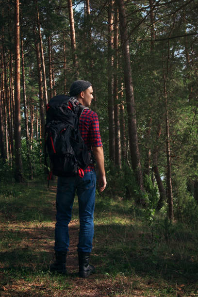 istock Hiking man in the forest 1049025894
