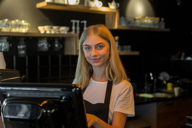 istock Female waiter entering order in computer 1049028850