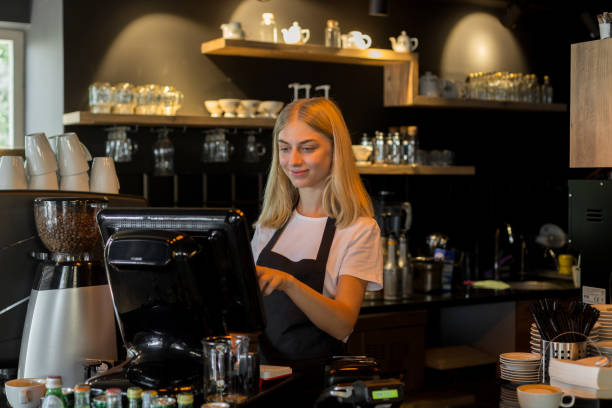 istock Female waiter entering order in computer 1049028922