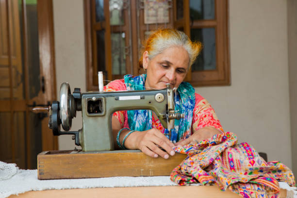 istock Woman sewing - Stock image 1049036118