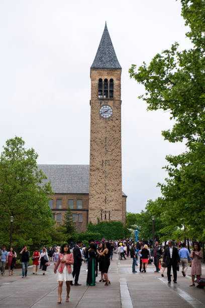 students and their family members gathered by jennie mcgraw tower in the campus of cornell university - mcgraw imagens e fotografias de stock