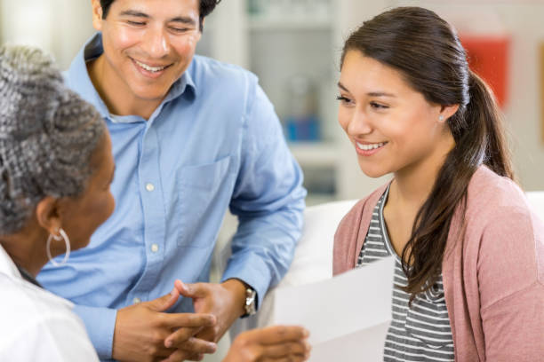 istock Doctor discusses diagnosis with patient 1049053522