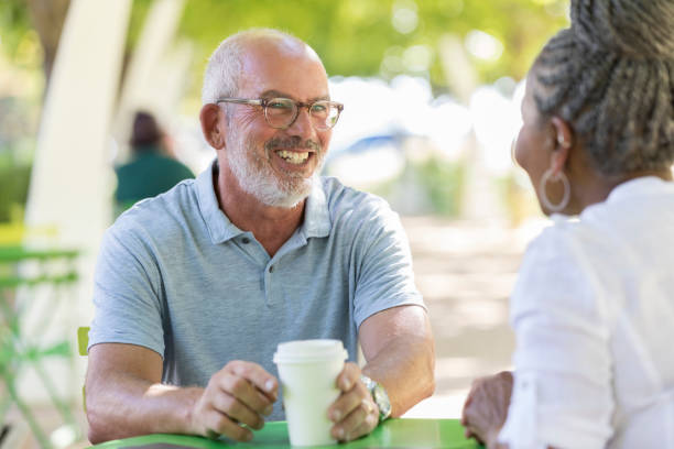istock Senior couple enjoy coffee together 1049053784