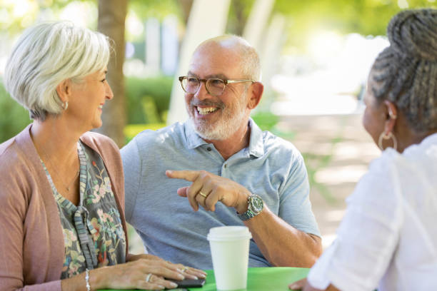 istock Senior couple have coffee with friend 1049053796