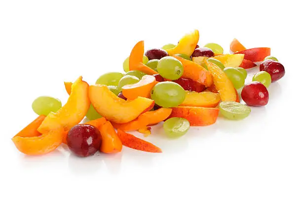 Grapes, nectarines, apricots and cherries small cut and photographed in a studio with white background