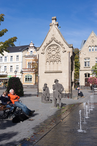 A senior couple enjoys a beautiful autumn day in the historic center of Bad Neuenahr. Rhineland Palatinate, Germany. September 2018