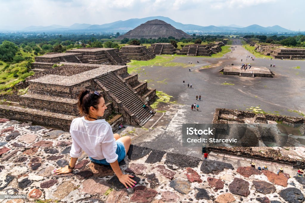 Tourism in Mexico - young adult tourist at ancient pyramids Tourism in Mexico City - young adult visits ancient Teotihuacan pyramids Mexico Stock Photo