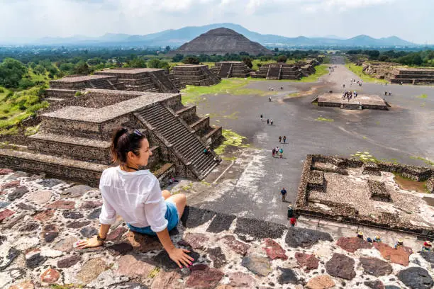 Tourism in Mexico City - young adult visits ancient Teotihuacan pyramids