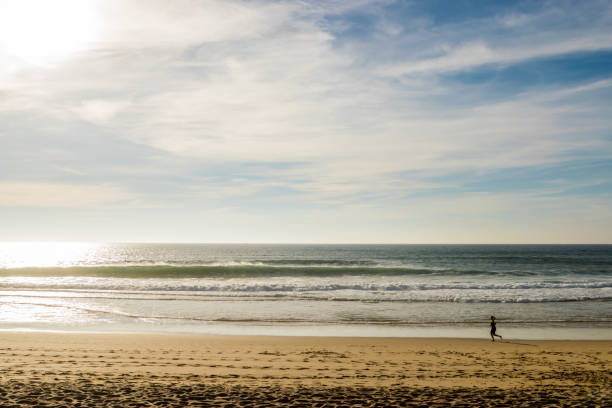istock Woman exercising on the beach 1049060812