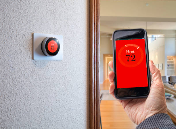 istock Digital Thermostat: Smart Home thermostat for smartphone internet wireless technology 1049066040