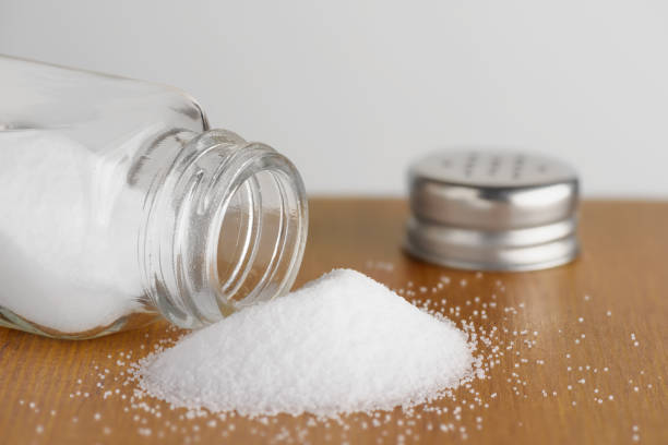 istock Salt shaker on wooden table 1049066160