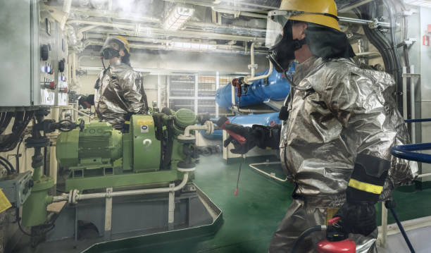 Collage of brave fireman exploring a fire scene onboard of a ship with torch and fire extinguisher in hands. Brave fireman exploring a fire scene onboard of a ship with torch and fire extinguisher in hands. All area around covered with smoke. Fire safety concept. drill team stock pictures, royalty-free photos & images