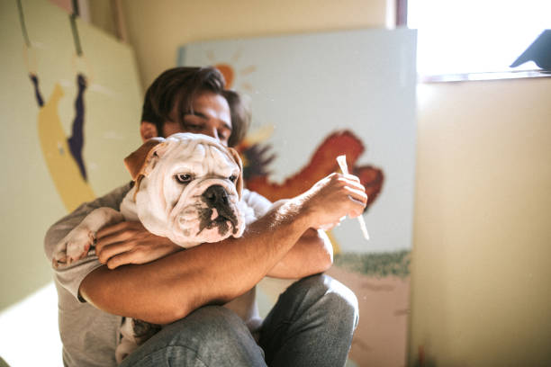 istock Painter And His Lovely Bulldog 1049084170