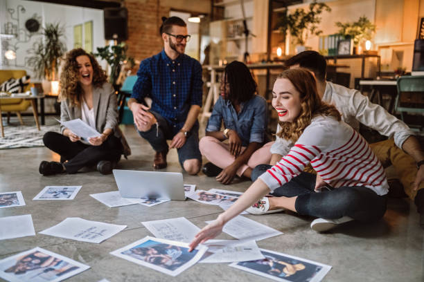 istock Young Creative People Picking Right Photographs 1049084536