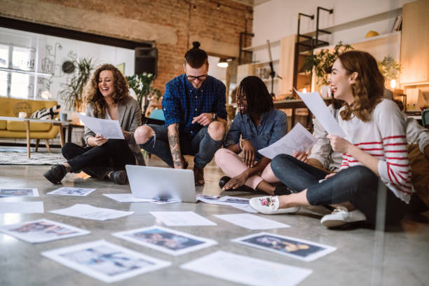 istock Young Creative People Picking Right Photographs 1049084614