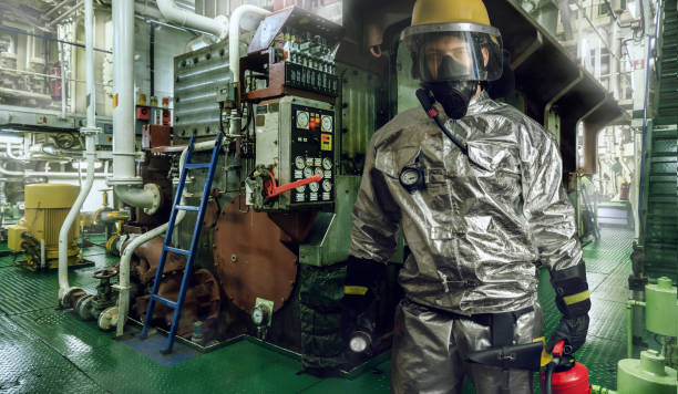 istock Collage of brave fireman exploring a fire scene onboard of a ship with torch and fire extinguisher in hands. 1049085490