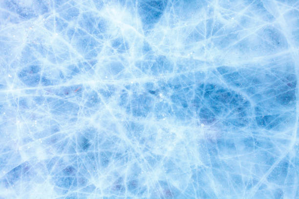 istock texture of a beautiful blue ice with cracks 1049089328