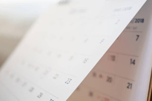 istock Abstract blur calendar page flipping sheet close up background 1049089546