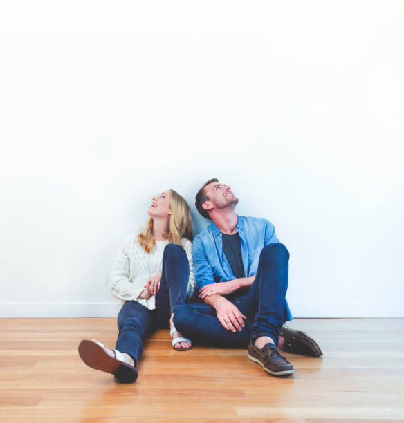 istock Couple dreaming and looking up. 1049107556