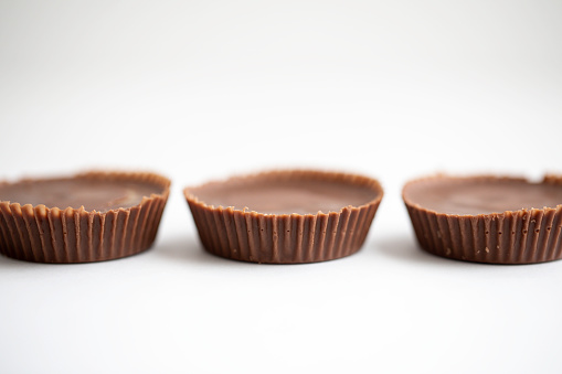 Peanut butter cups shot on a white background macro