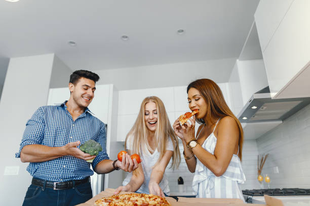 istock friends eatting in a kitchen 1049118138