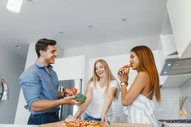 istock friends eatting in a kitchen 1049118140