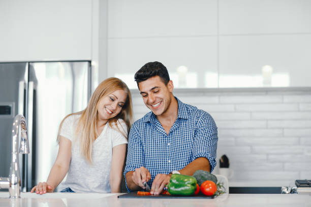 istock couple at home in a kitchen 1049118170